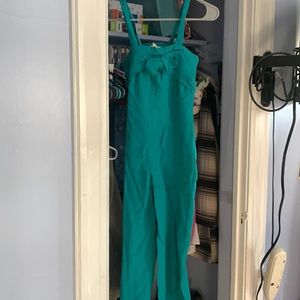 Teal jumper with bow on it